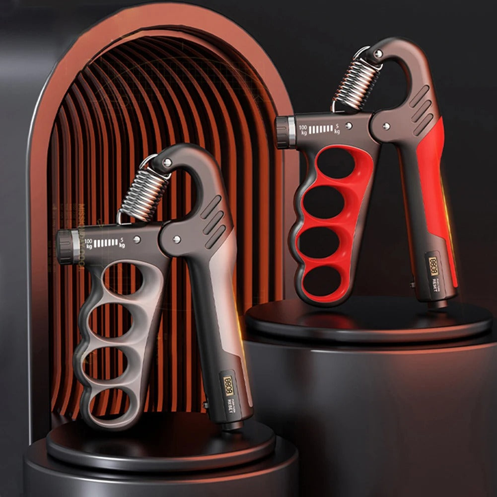 Two hand grip exercisers, one black and silver, one red and black, on a dark background.